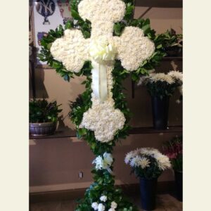 CR1100: Celtic white carnation cross with lemon leaf