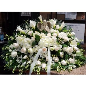 CS1610: Assorted All White Casket Spray with Angel Statue